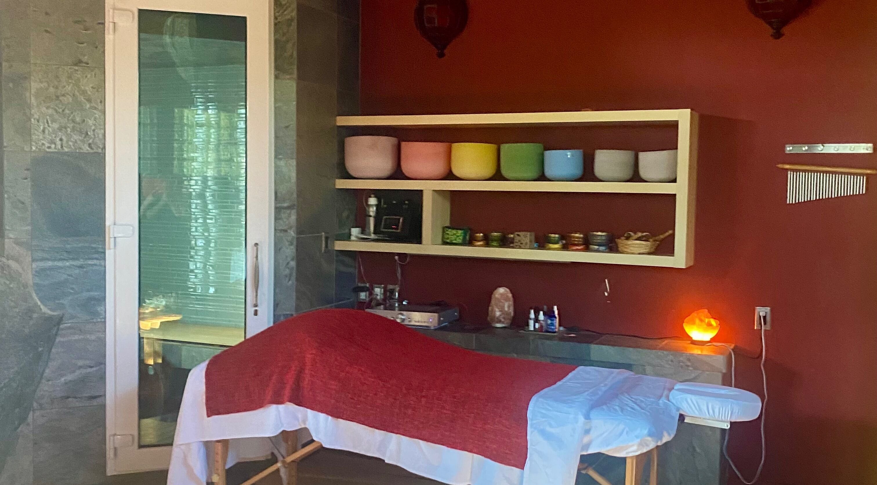 Massage room at Freedom Spa Mobile - Bali Casa in Halfmoon Bay, BC, CA with therapeutic furnishings.