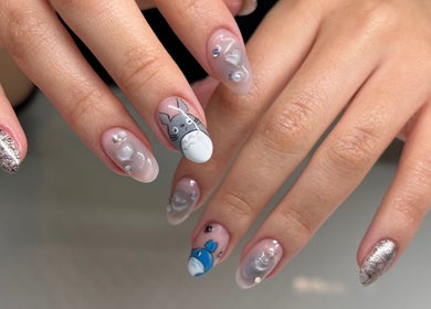 Elegantly designed artistic nails at Cindy's Nails, Denver, Colorado, US, showcasing intricate detailing.