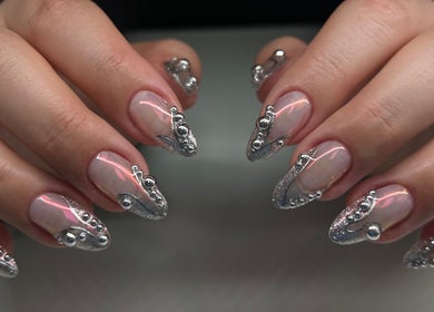 Elegant nail art showcasing dazzling metallic accents at Cindy's Nails, Denver, Colorado, US.