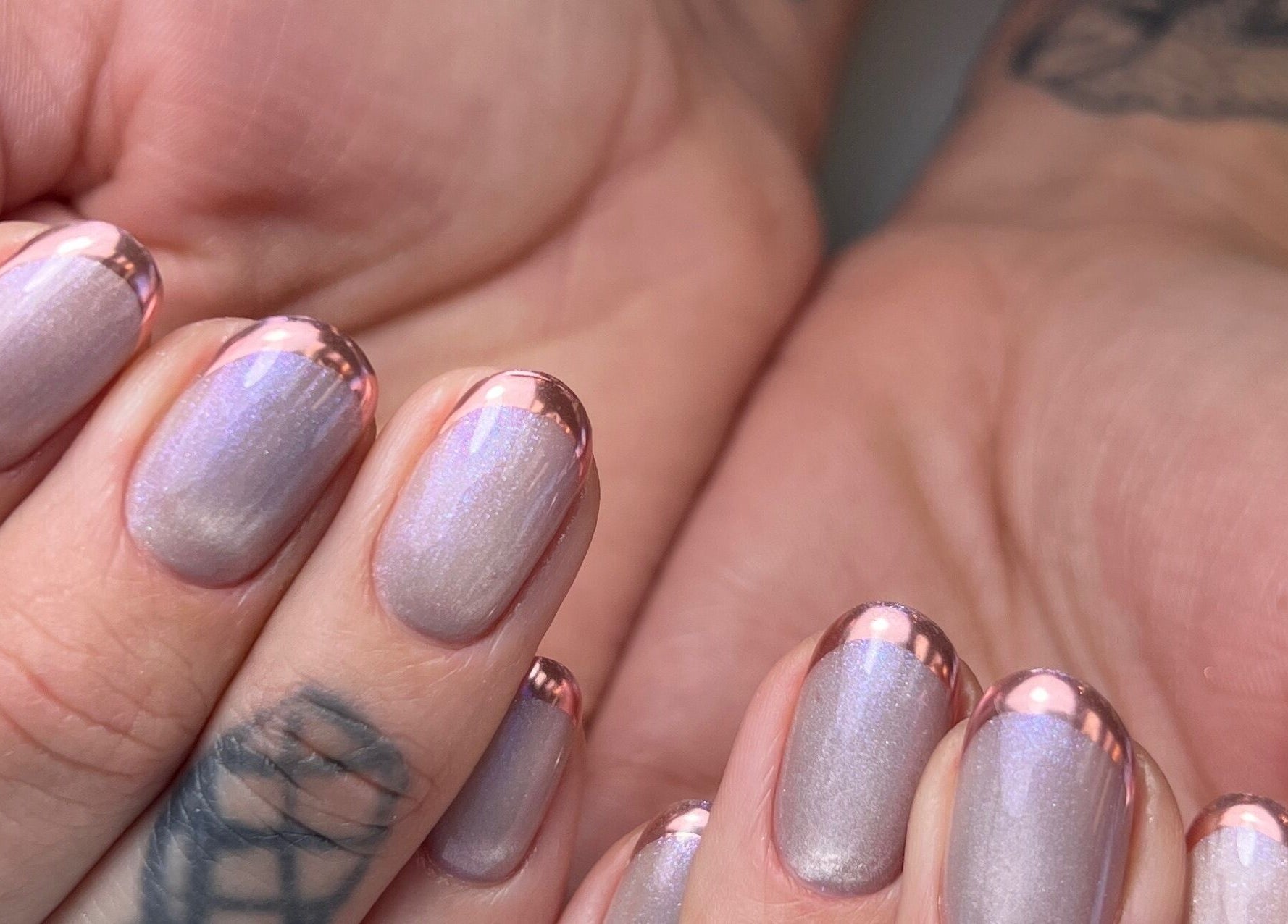 Elegant metallic nails with pink chrome tips at Cindy's Nails, Denver, Colorado, US.