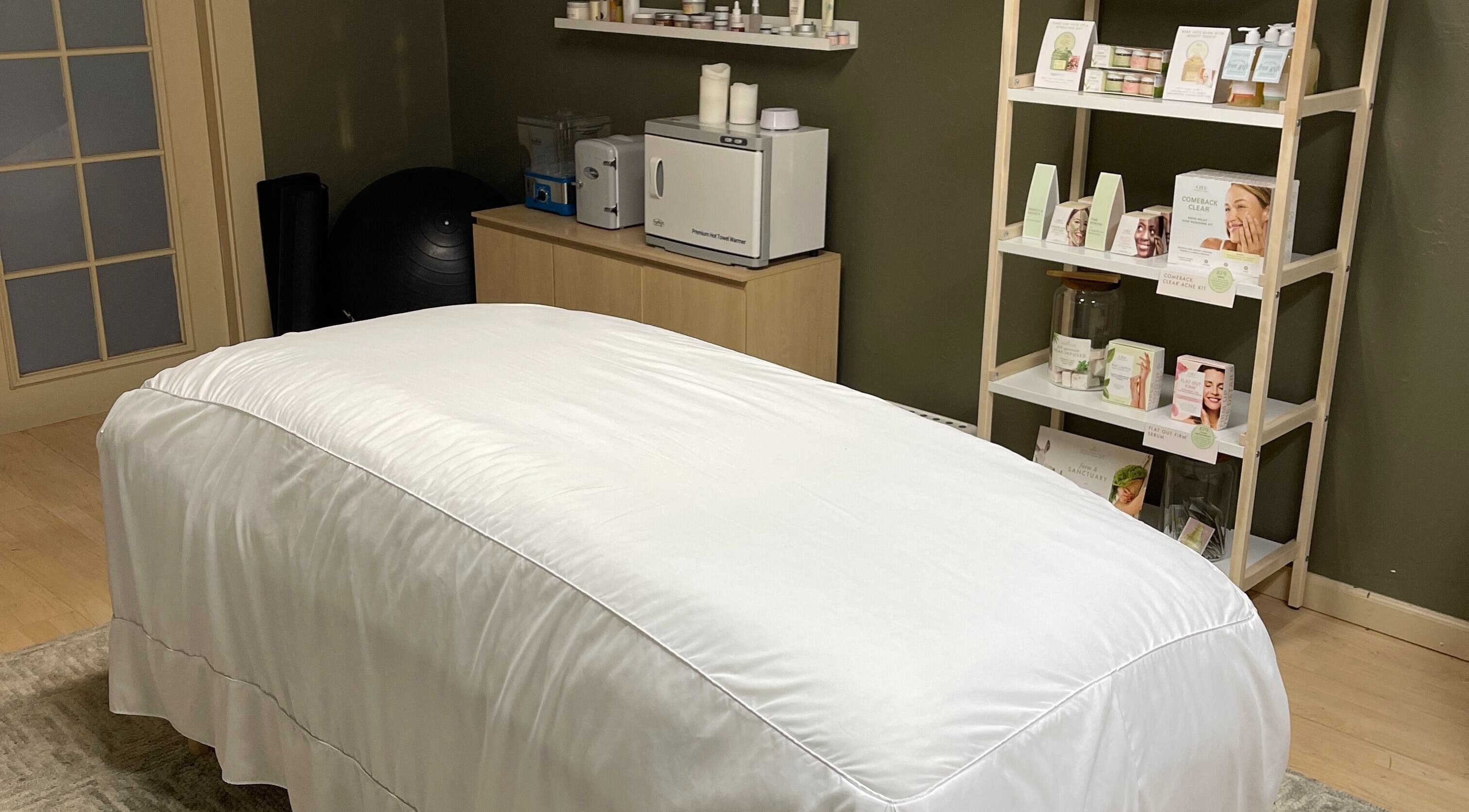 Calming massage room at The June Massage and Skin Studio in Monroe, Washington, US, featuring a treatment bed.