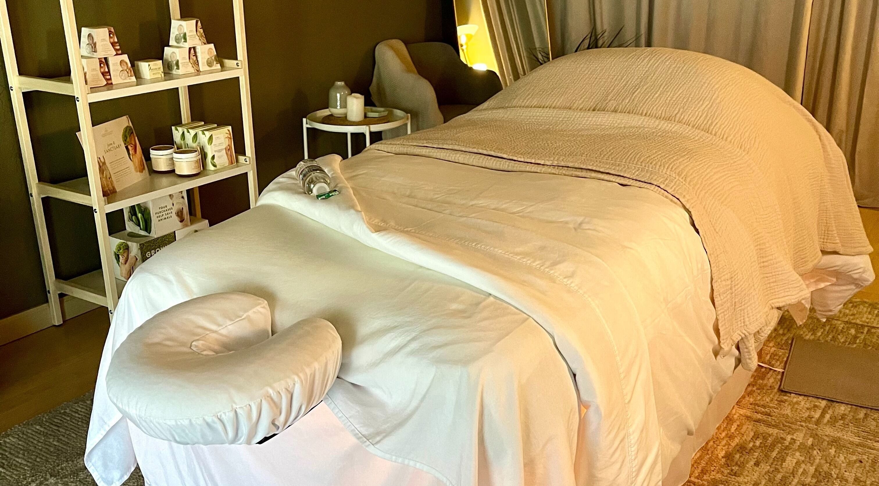 Relaxing massage room at The June Massage and Skin Studio, Monroe, Washington, US with calming decor.