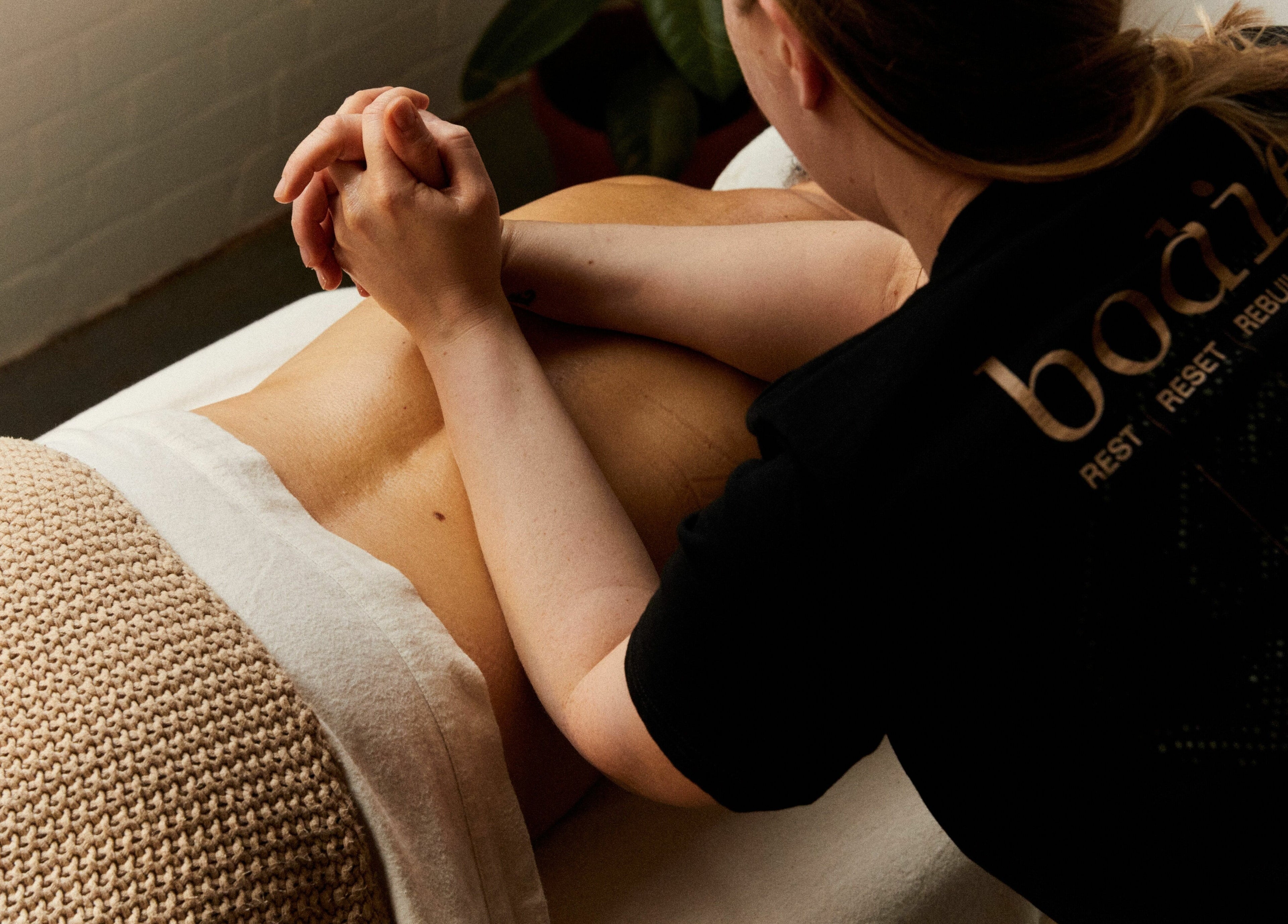Massage therapy session at Bodied, London, England, GB highlighting relaxation and well-being.