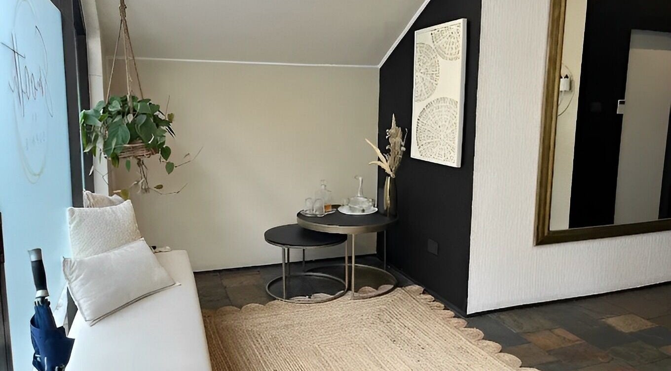 Elegant seating area at Smooth by Sophie, Milsons Point, NSW, AU with modern decor and natural elements.
