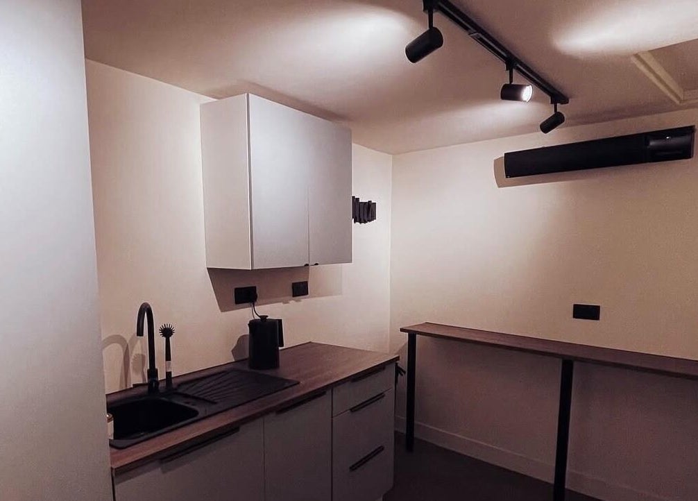 Modern kitchen at Mono, Hoyland, England, GB featuring sleek counters and cabinets.