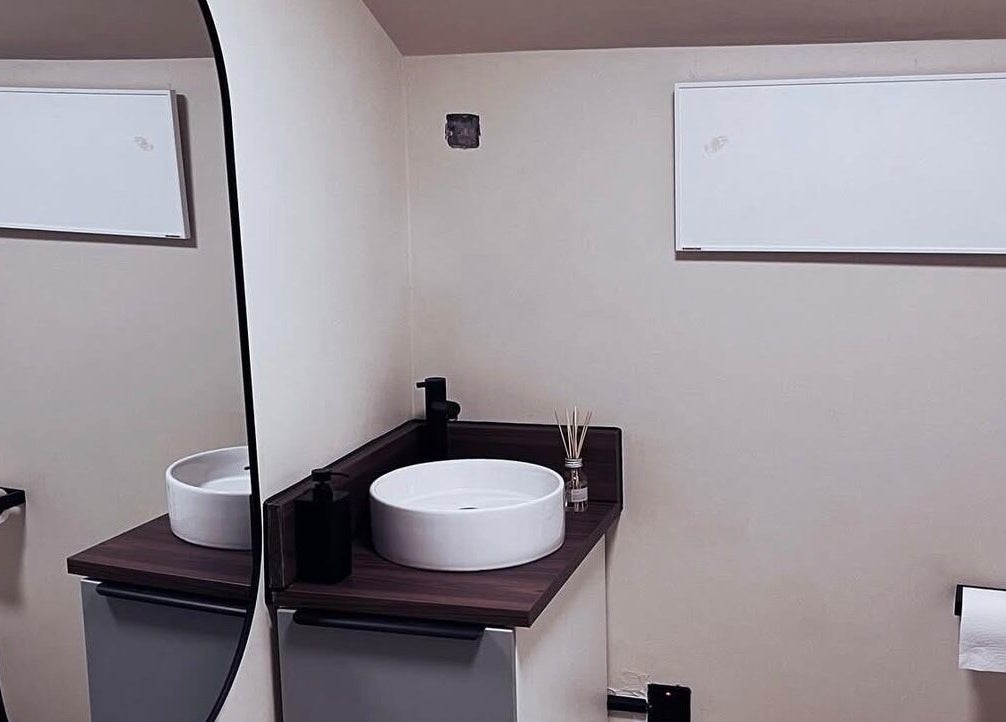 Stylish bathroom vanity at Mono in Hoyland, England, GB, featuring modern sink and sleek mirror.