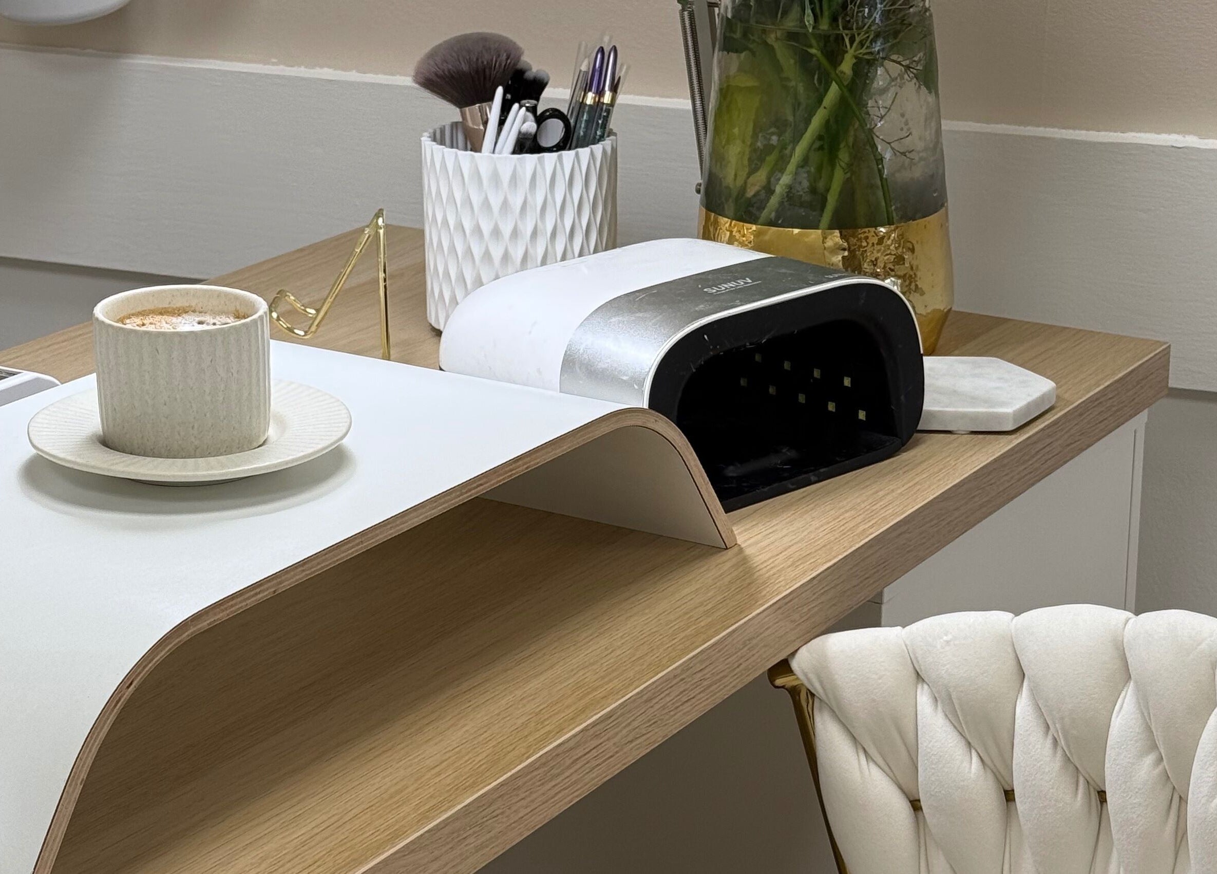 Relaxing manicure station at Olive Nails Studio, Kilmarnock, Scotland, GB with tools, chair, and coffee.