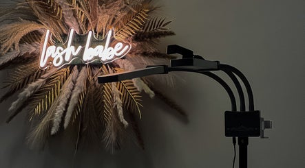 Neon sign 'lash babe' and decor at Lil Beautique, Crawley, England, GB. Chic and inviting salon ambiance.