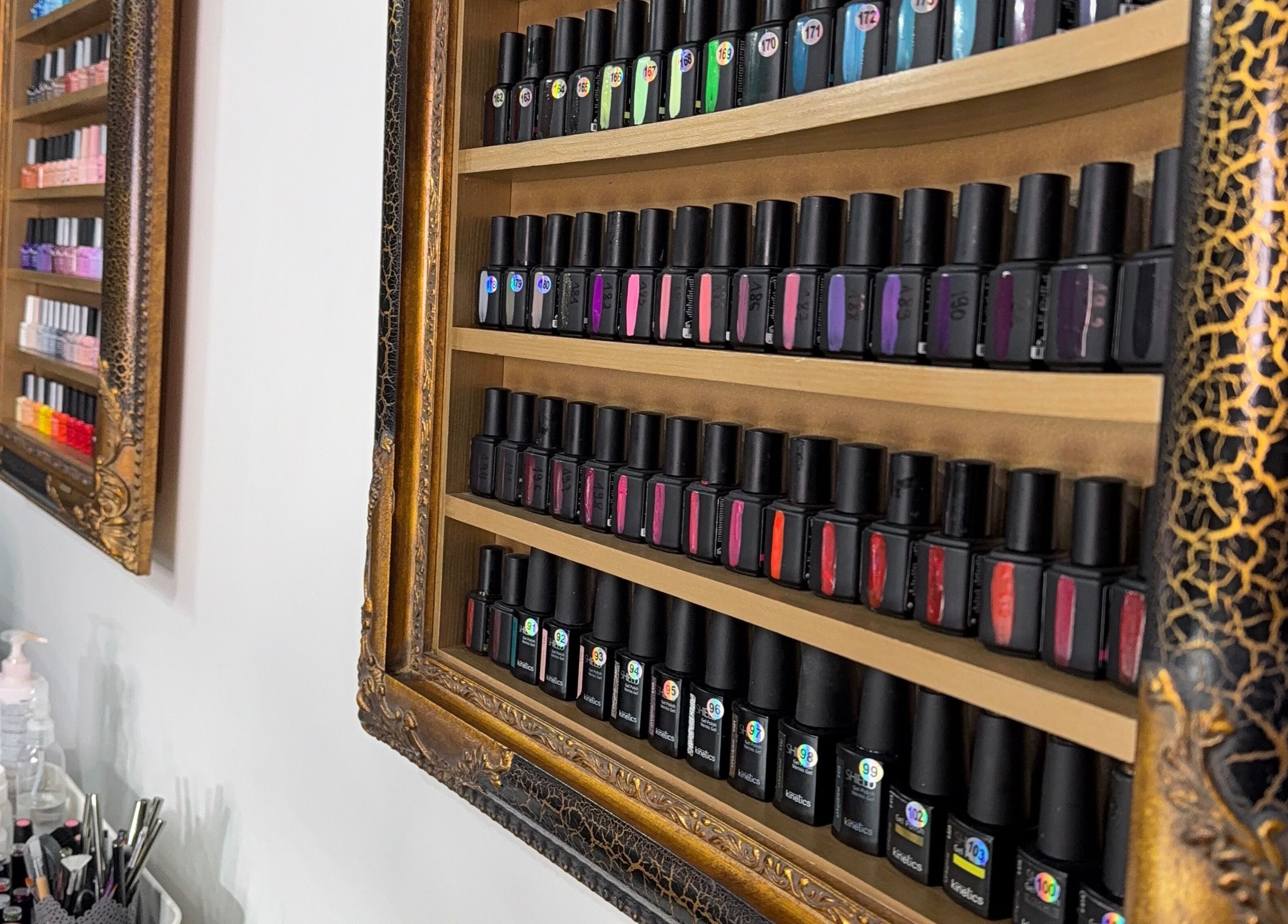 Nail polish collection at Royal Gold Studios, Mullingar, County Westmeath, IE, elegantly framed on a wall.