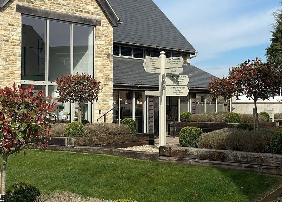 Moonlight Nails By Meg At Elkstone facade, showcasing lush gardens and classic stone architecture in Elkstone, England, GB.