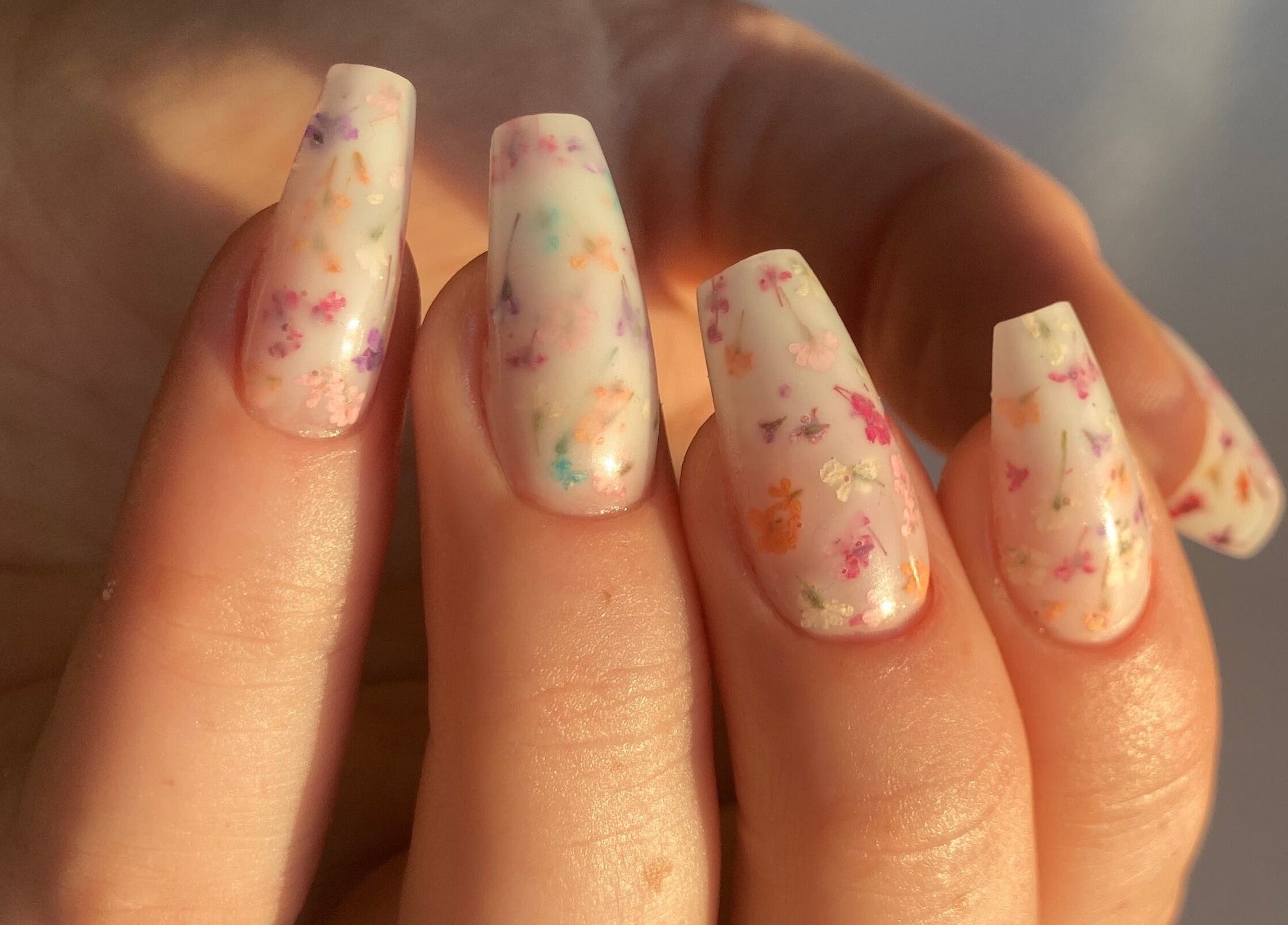 Elegant floral nail art by Moonlight Nails By Meg At Elkstone, England, GB in soft pastel shades.