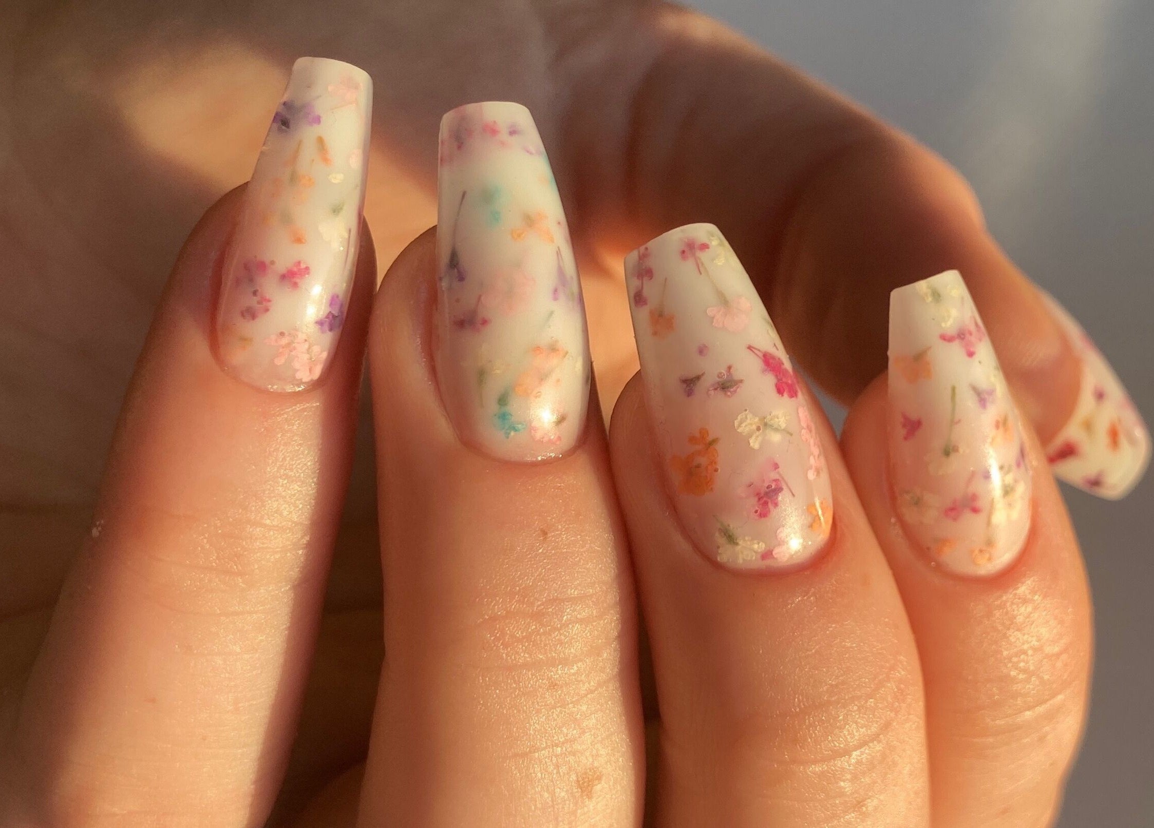 Elegant floral nail art by Moonlight Nails By Meg At Elkstone, England, GB in soft pastel shades.