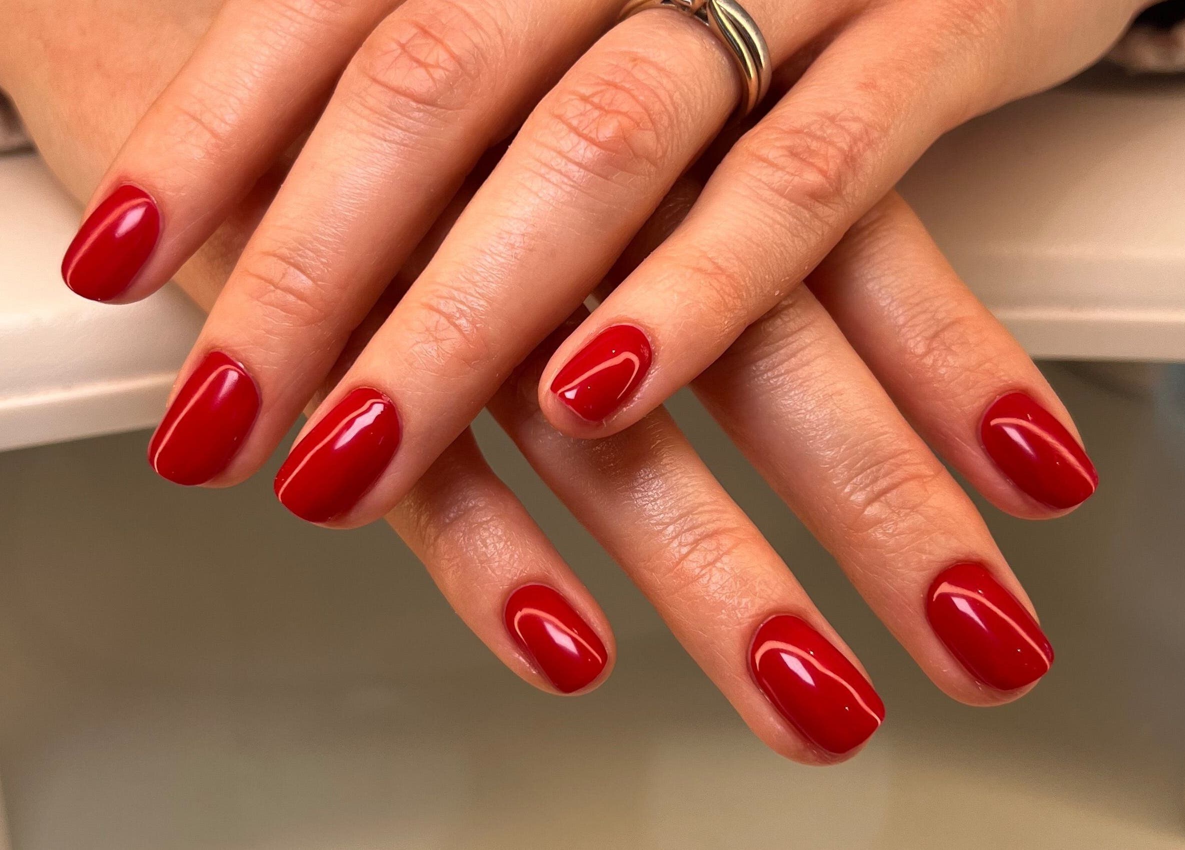 Bright red nails manicure at Moonlight Nails By Meg At Elkstone, Elkstone, England, GB.
