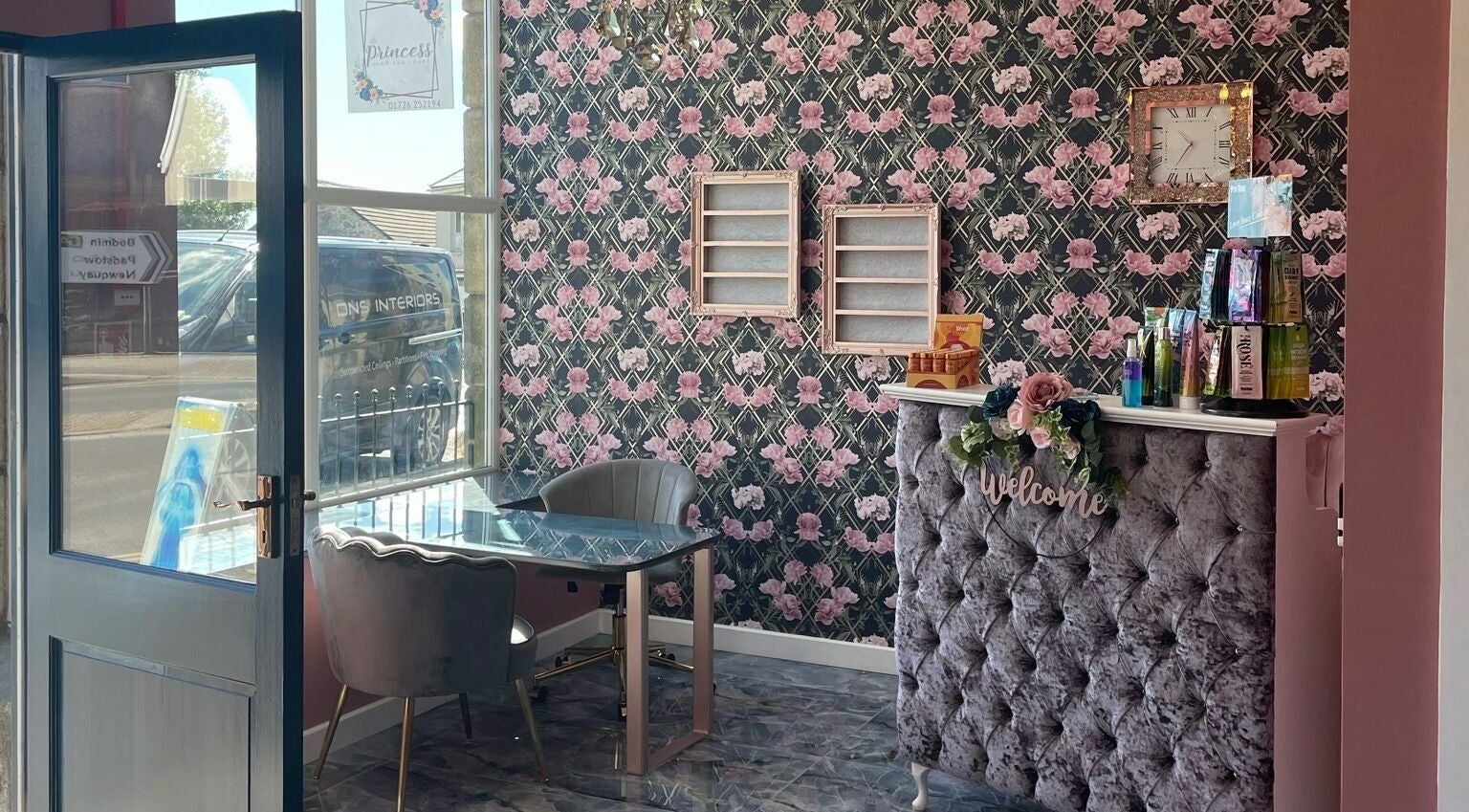 Elegant reception area at Princess Glam and Locks, Roche Cornwall, St Austell, England, GB with floral wallpaper.