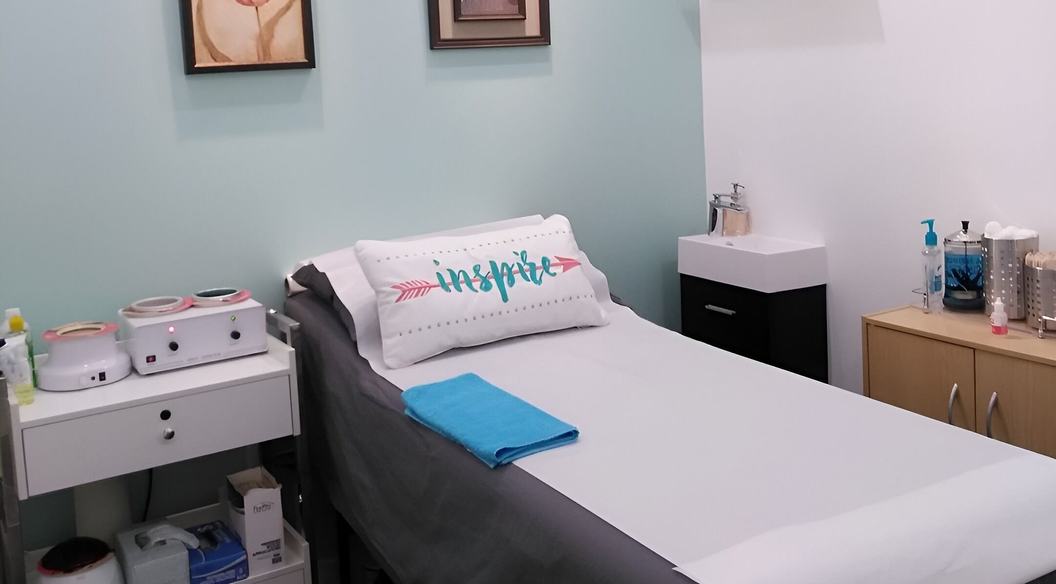 Relaxing treatment room at Liza's Skincare and Waxing Studio in Chicago, Illinois, US, featuring a cozy bed.