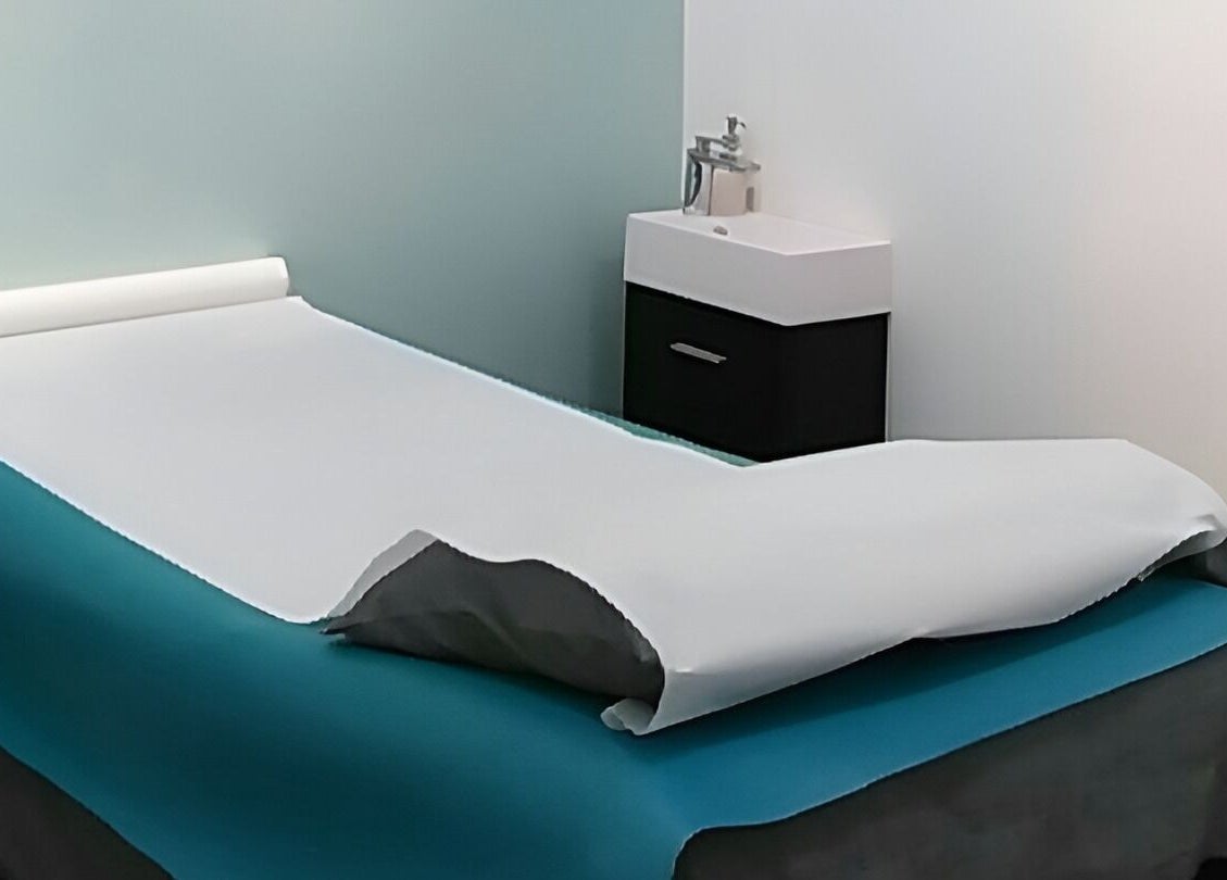 Relaxing treatment room at Liza's Skincare and Waxing Studio in Chicago, Illinois, US, featuring a comfortable bed.