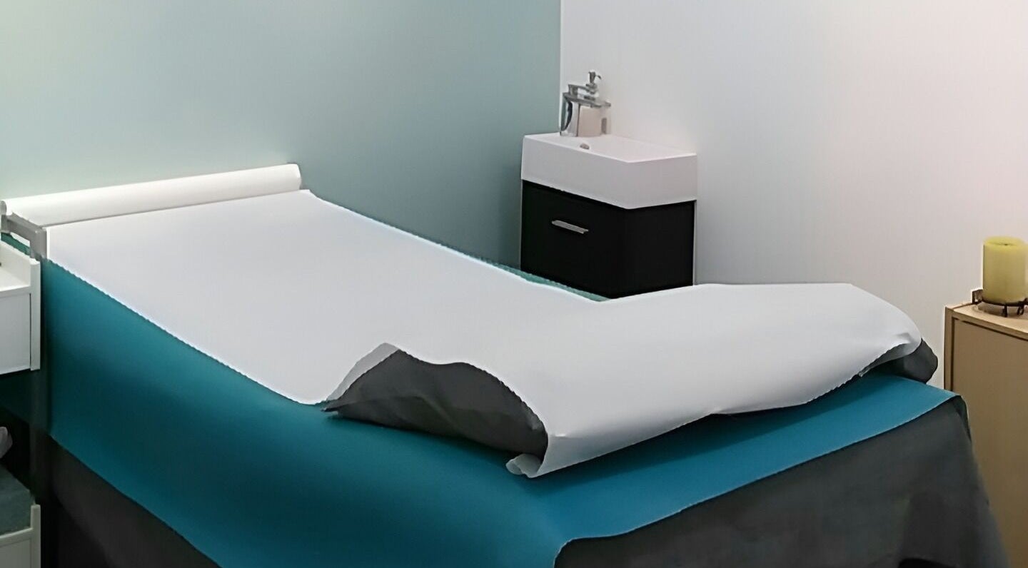 Relaxing treatment room at Liza's Skincare and Waxing Studio in Chicago, Illinois, US, featuring a comfortable bed.
