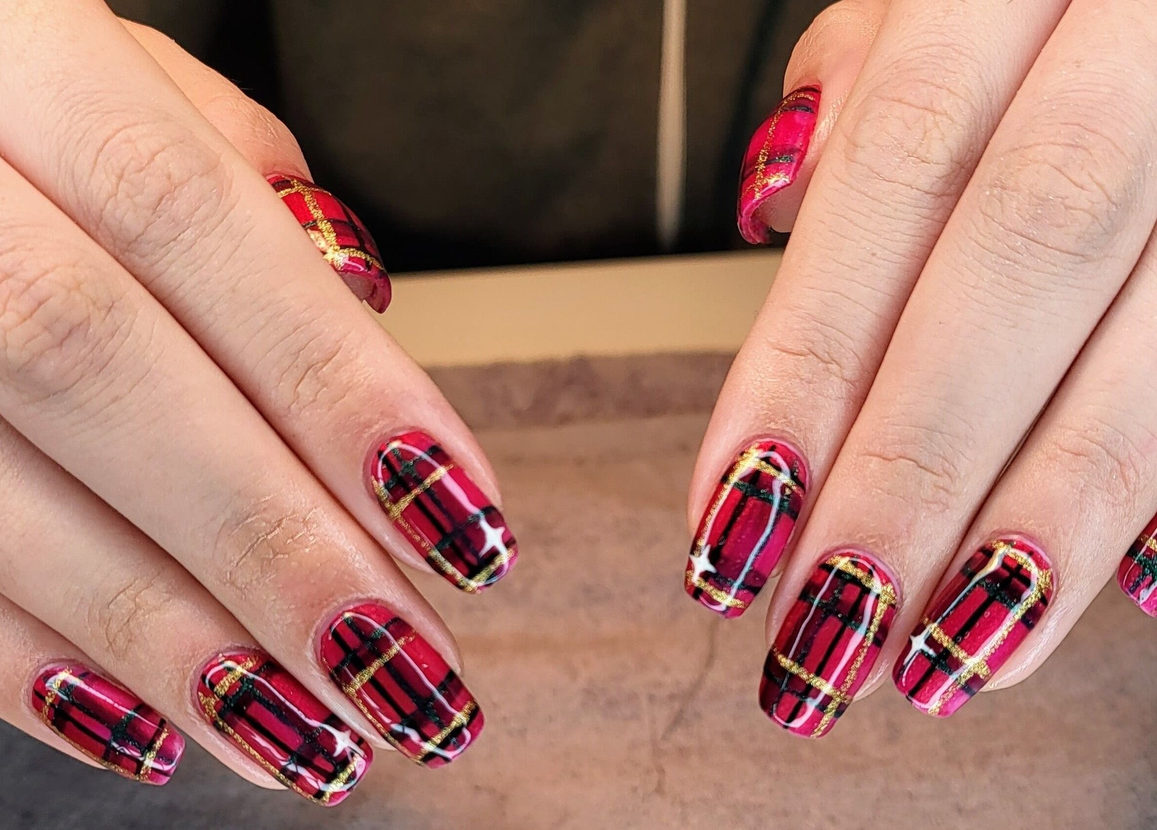 Vibrant plaid nail art at CCB Nails and Beauty, Basingstoke, England, GB showcasing intricate design.