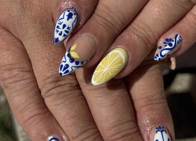 Elegant, artistic nail design at The Nail Gallery and Beauty, Bodmin, England, GB. Features lemon and blue patterns.