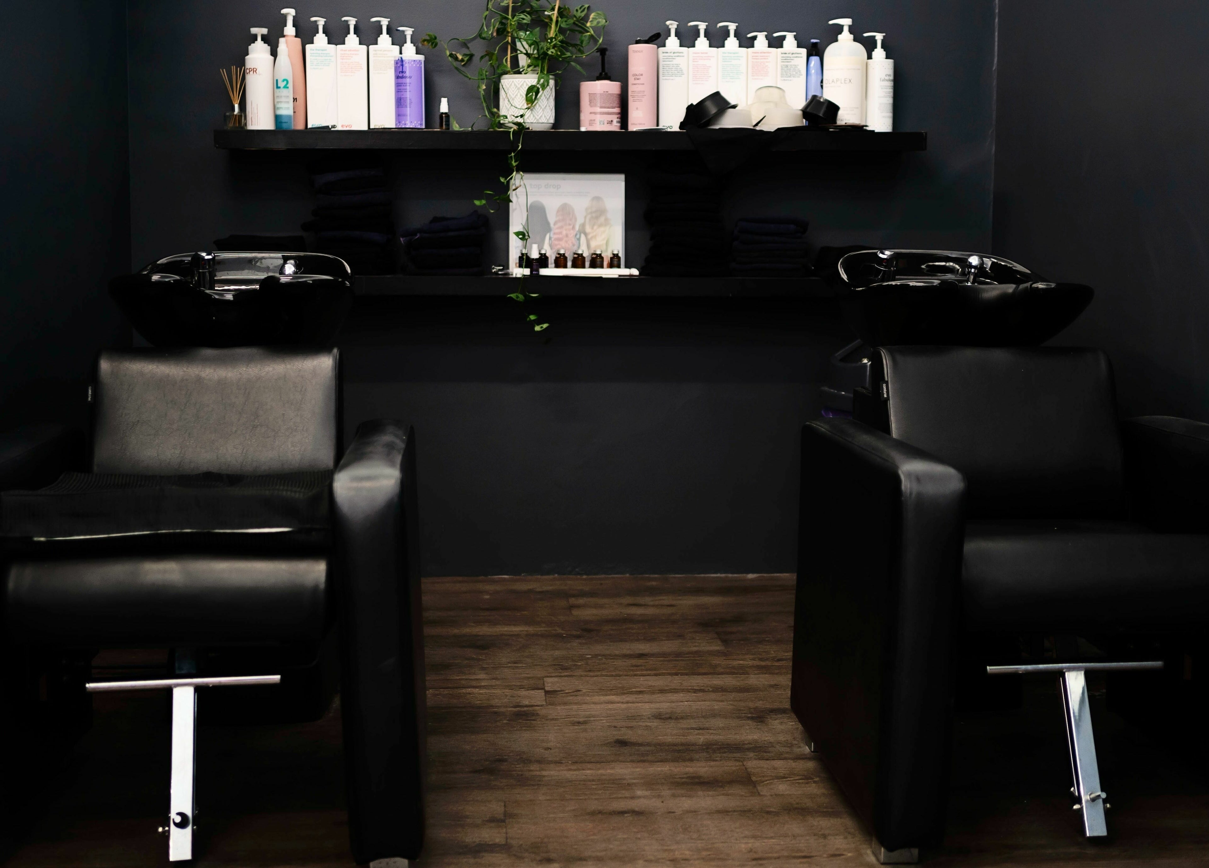 Floreat Hair rinse area with sleek black chairs, City of Nedlands, Western Australia, AU.