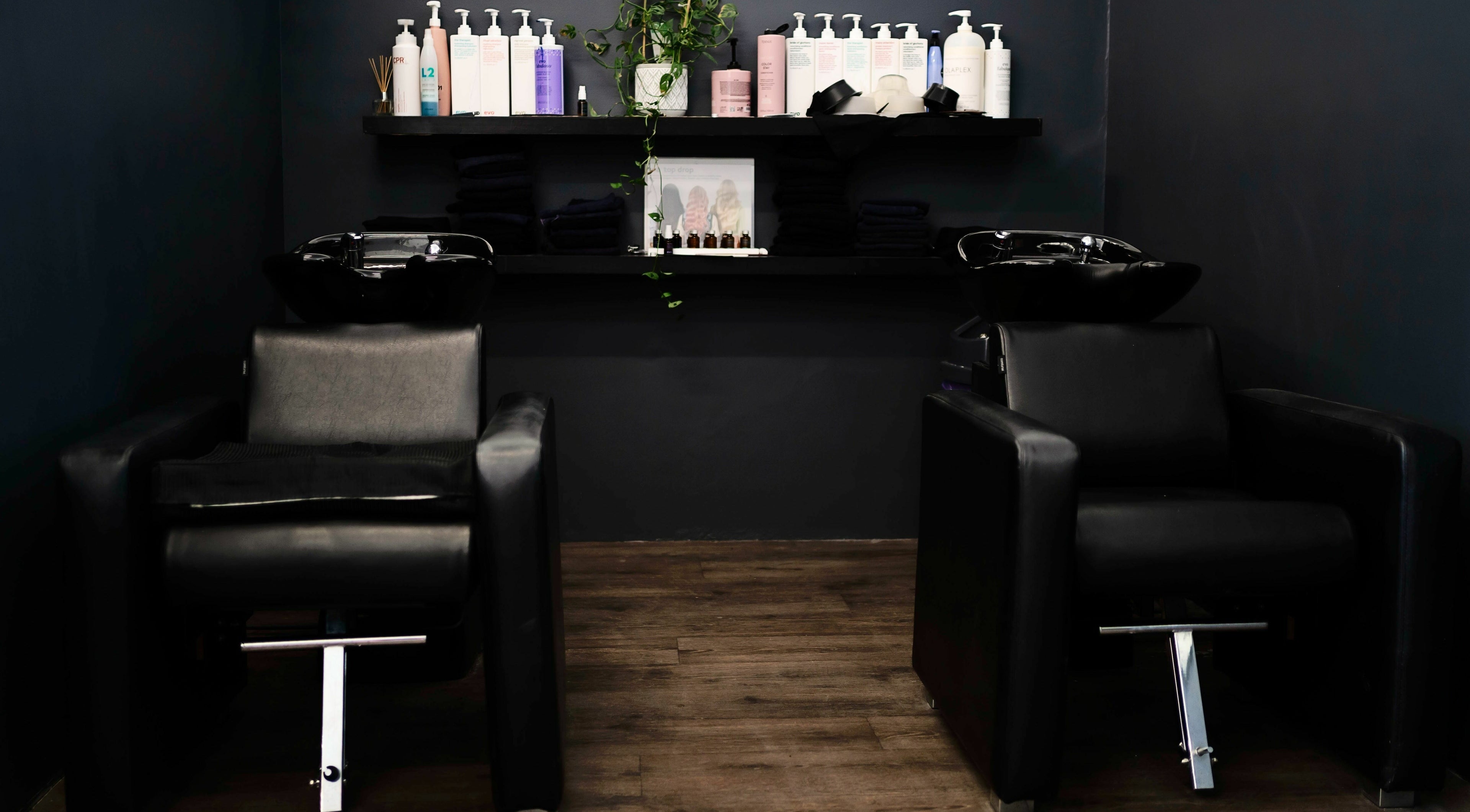 Floreat Hair rinse area with sleek black chairs, City of Nedlands, Western Australia, AU.