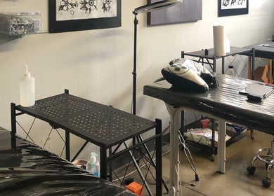 Tattoo station setup at Jane-Doe Ink Kramerville, Sandton, Gauteng, ZA, showcasing tools and workspace.