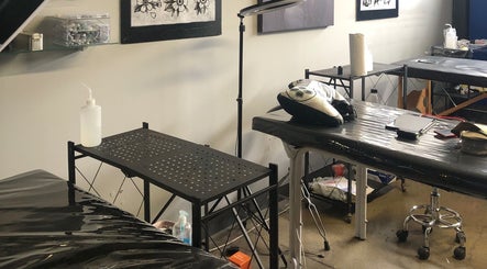 Tattoo station setup at Jane-Doe Ink Kramerville, Sandton, Gauteng, ZA, showcasing tools and workspace.