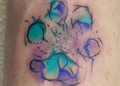 Colorful paw print tattoo design at Jane-Doe Ink Kramerville, Sandton, Gauteng, ZA.