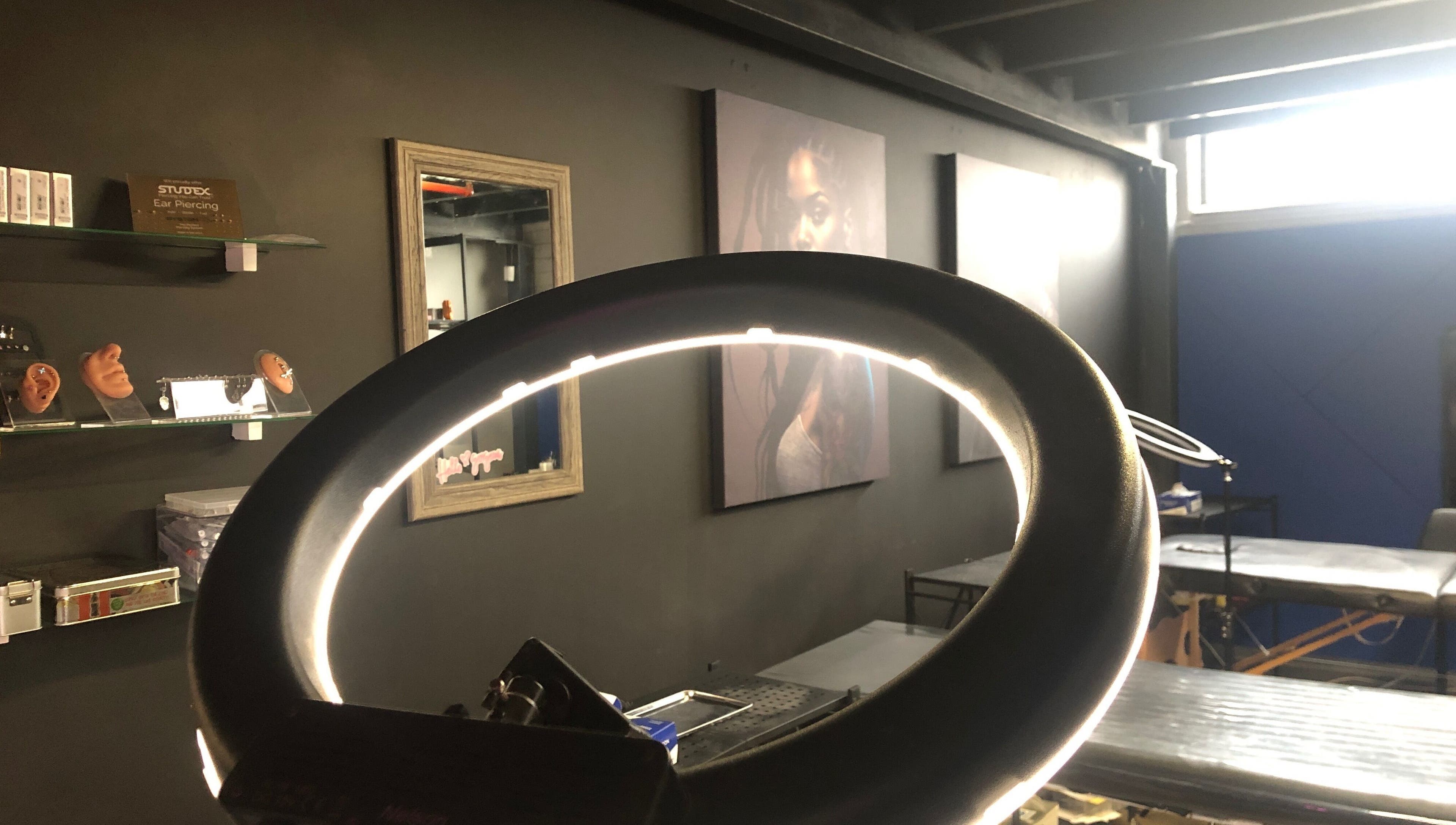 Inside view of Jane-Doe Ink Kramerville, showcasing sleek setup with ring light, Sandton, Gauteng, ZA.
