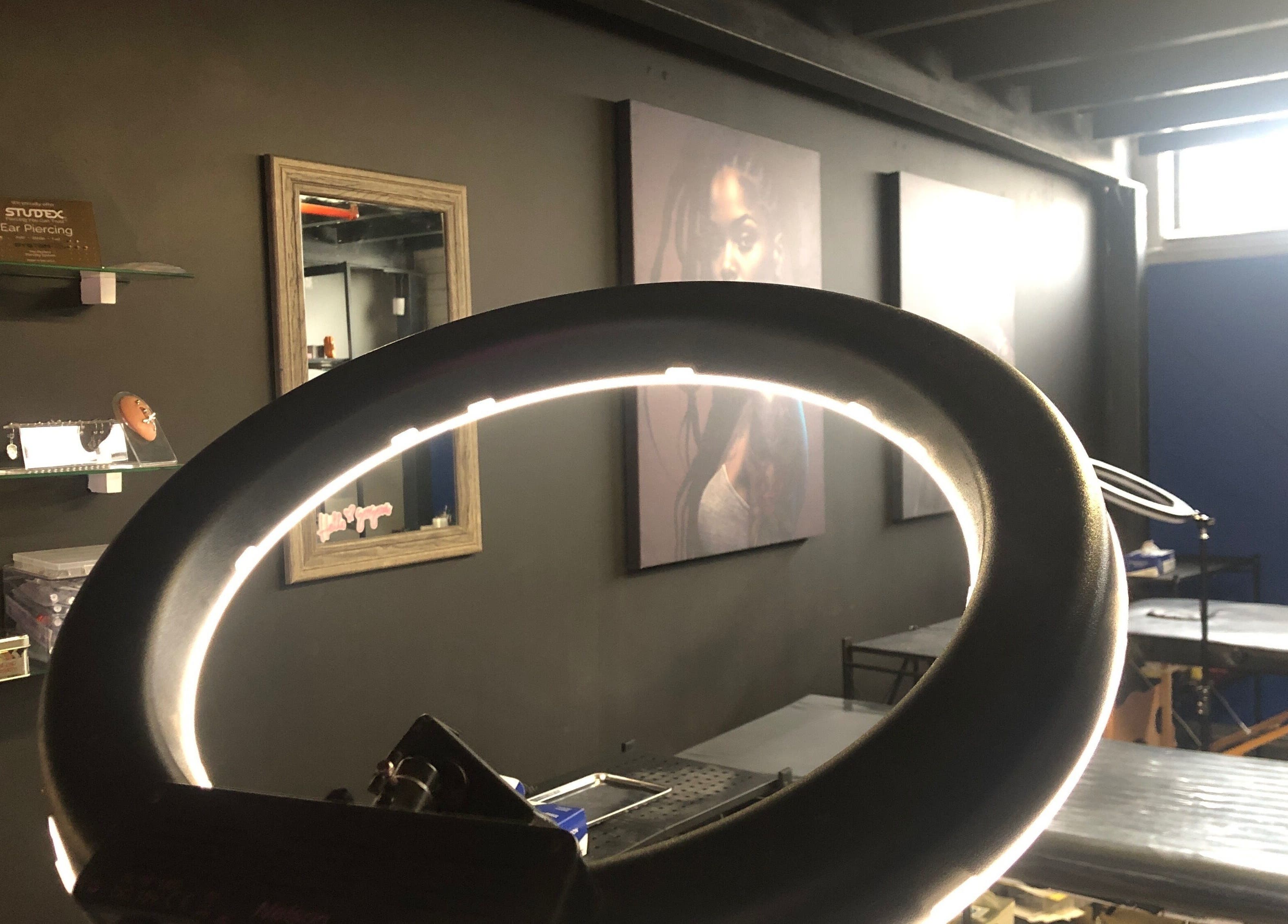 Inside view of Jane-Doe Ink Kramerville, showcasing sleek setup with ring light, Sandton, Gauteng, ZA.