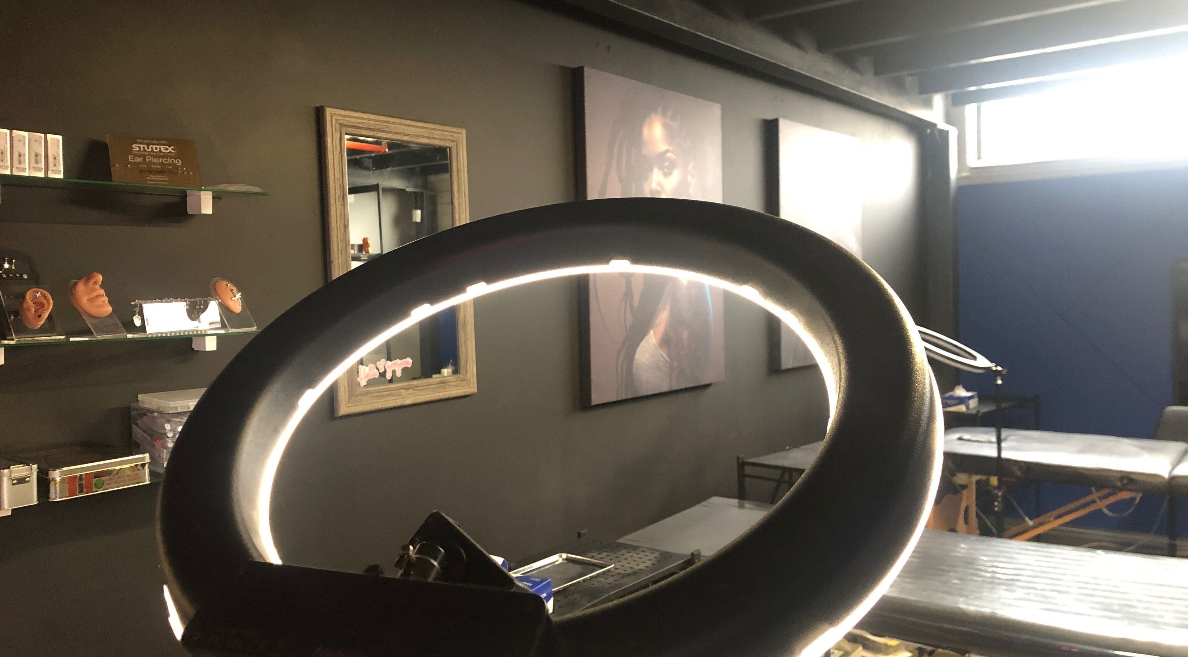Inside view of Jane-Doe Ink Kramerville, showcasing sleek setup with ring light, Sandton, Gauteng, ZA.