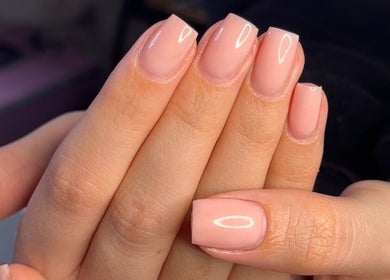 Close-up of manicured nails at AJ Beauty Studio in Hucknall, England, GB with a polished nude finish.