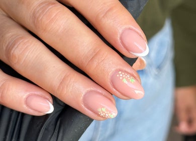 Elegant floral French manicure at AJ Beauty Studio, Hucknall, England, GB. Perfect for chic, stylish looks.