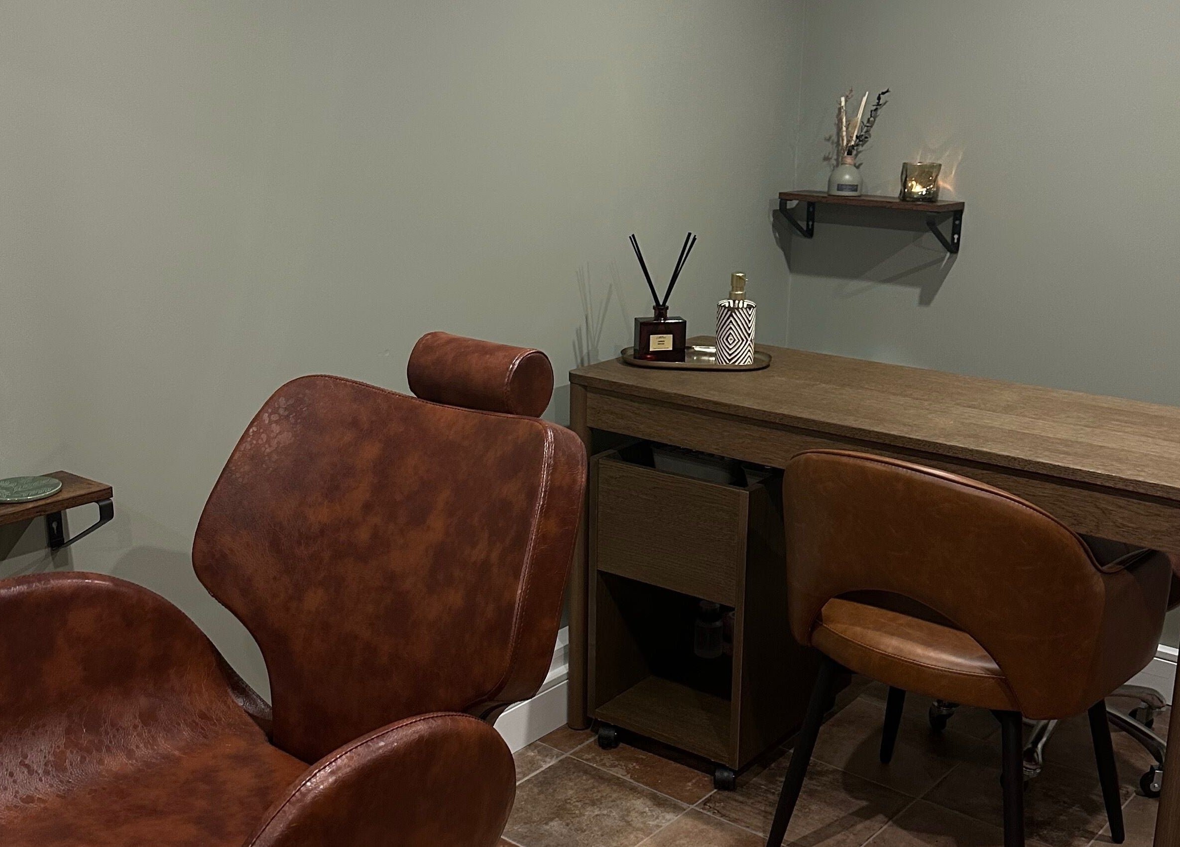 Chic seating at AJ Beauty Studio, Hucknall, England, GB, highlighting a calming decor and workspace.