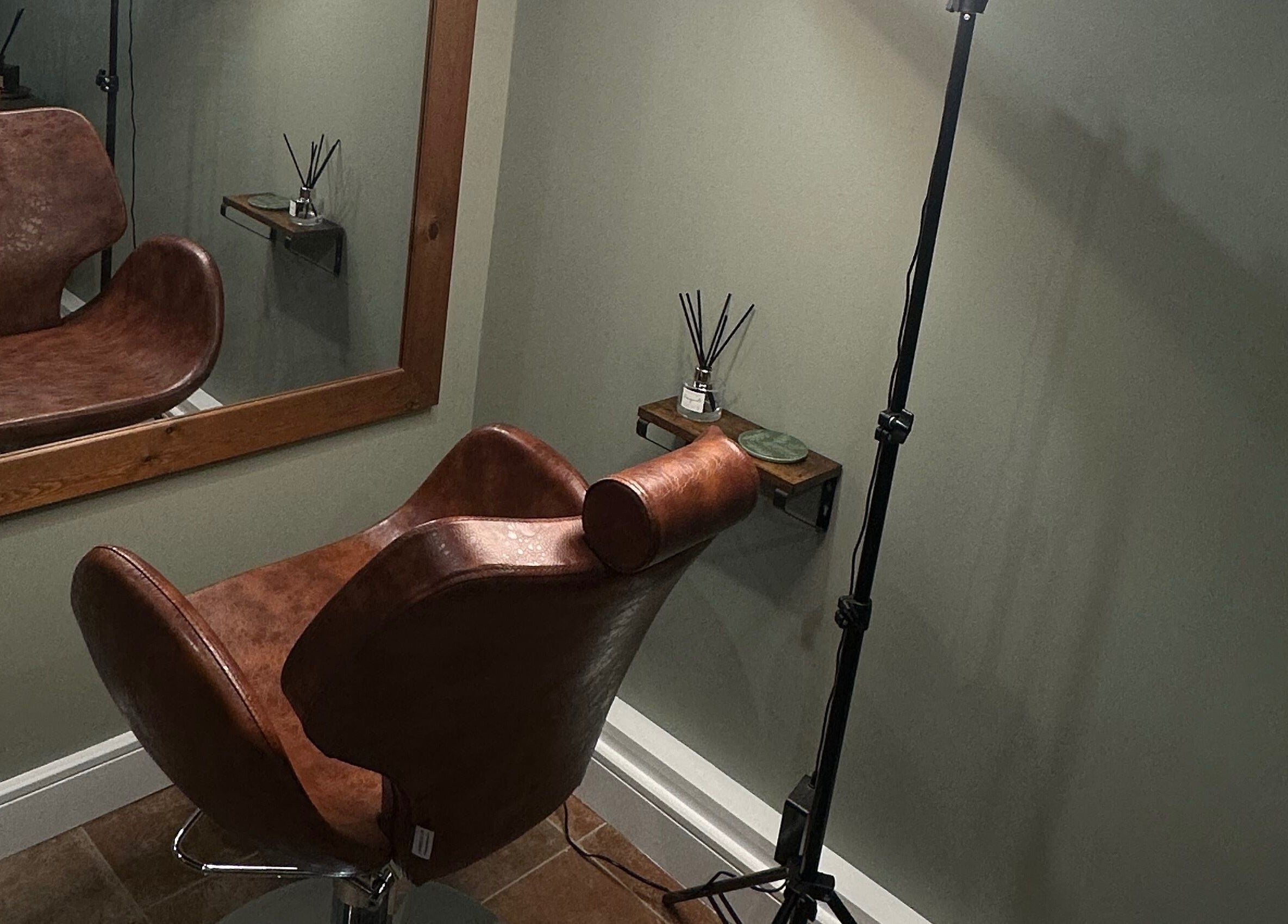 AJ Beauty Studio / The Skin Salon in Hucknall, England, GB features a stylish, cozy salon corner with a leather chair.