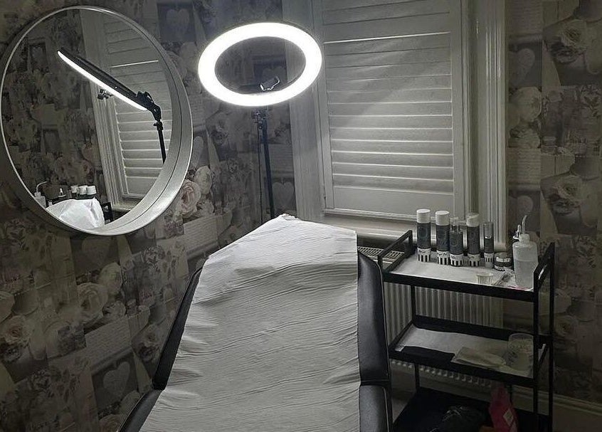 AJ Beauty Studio treatment room features modern decor and equipment in Hucknall, England, GB.