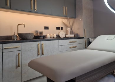 Treatment room at Aesthetics Fifty Five in Wakefield, England, GB with stylish decor and a modern treatment bed.