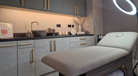 Treatment room at Aesthetics Fifty Five in Wakefield, England, GB with stylish decor and a modern treatment bed.
