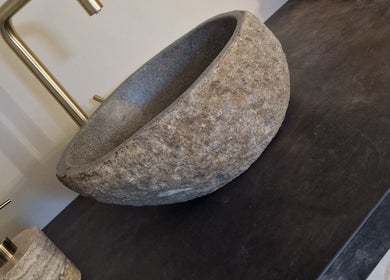 Rustic stone basin at Aesthetics Fifty Five, Wakefield, England, GB offers a serene and natural vibe.