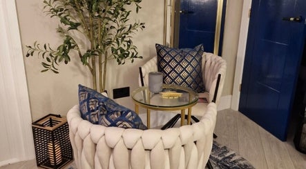 Elegant seating area at Aesthetics Fifty Five, Wakefield, England, GB with plush chairs and decor.