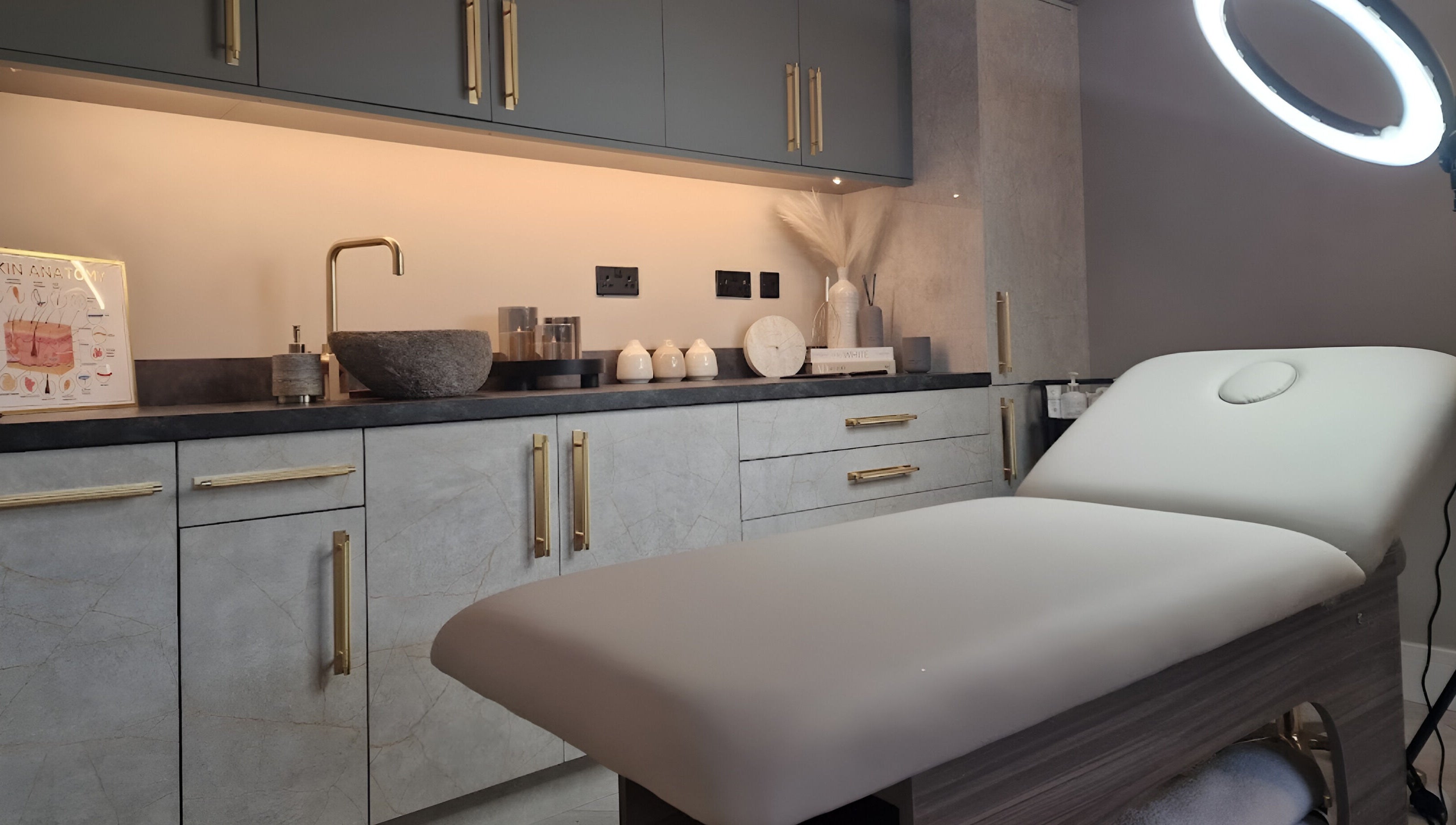 Elegant treatment room at Aesthetics Fifty Five, Wakefield, England, GB with modern decor and plush treatment bed.