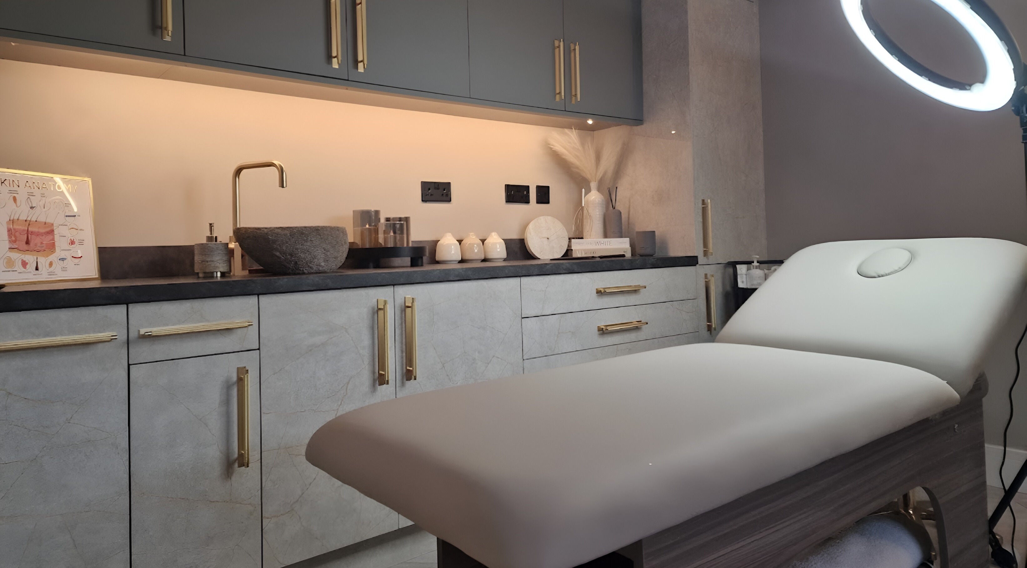 Elegant treatment room at Aesthetics Fifty Five, Wakefield, England, GB with modern decor and plush treatment bed.