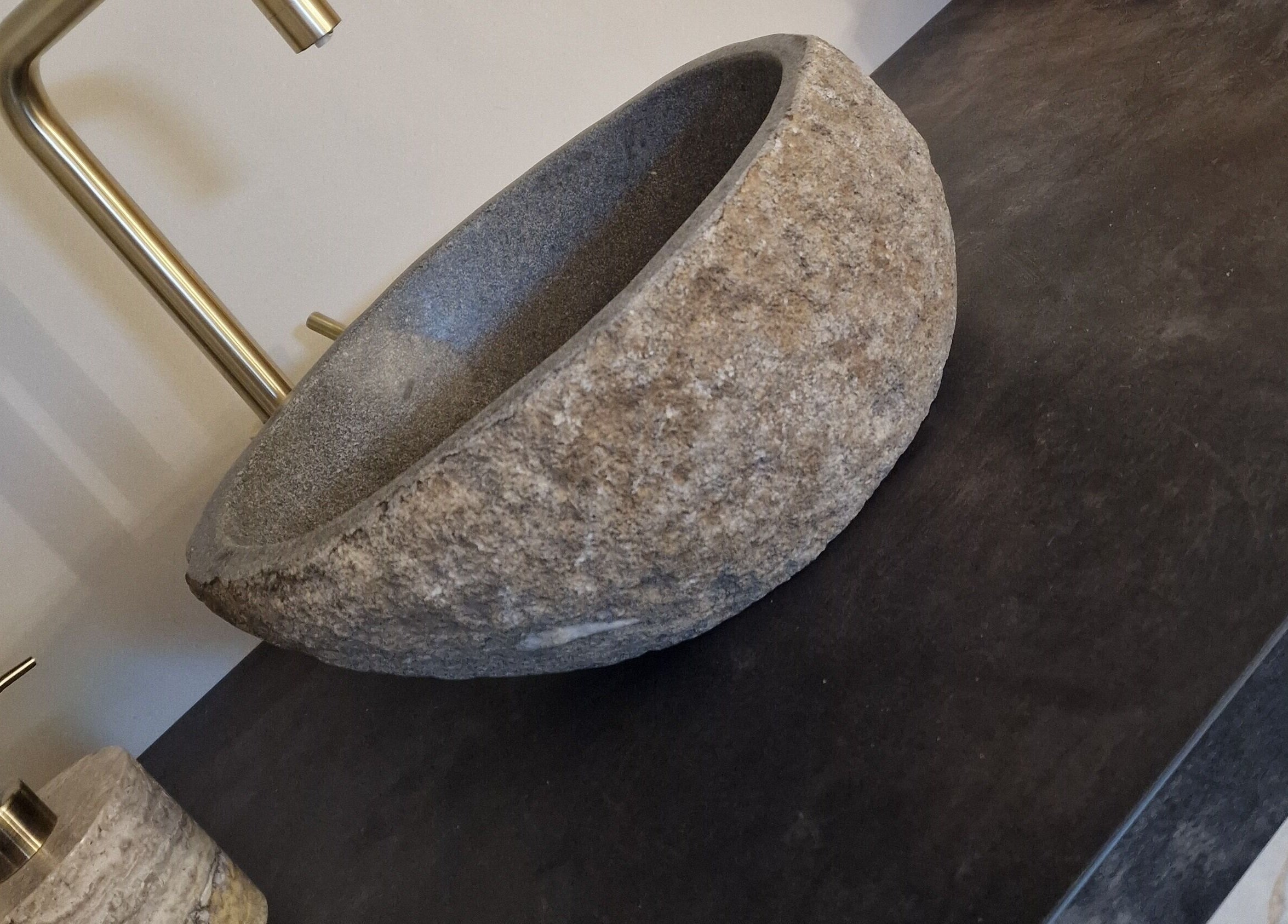 Stone basin and brass tap at Aesthetics Fifty Five, Wakefield, England, GB