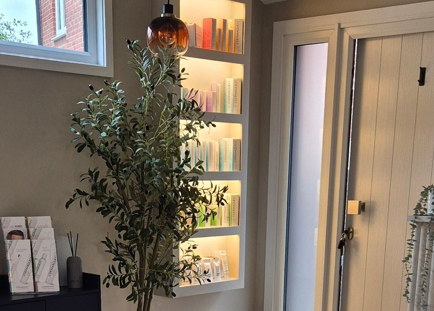 Aesthetic display at Aesthetics Fifty Five, Wakefield, England, GB with modern decor and product shelves.