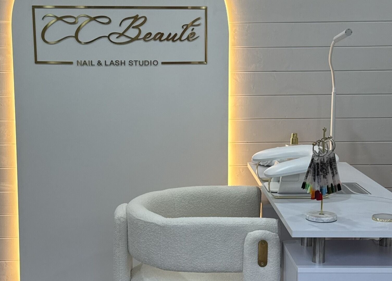 Cc Beautè nail and lash studio in Cardiff, Wales, GB with chic white decor and modern tools.