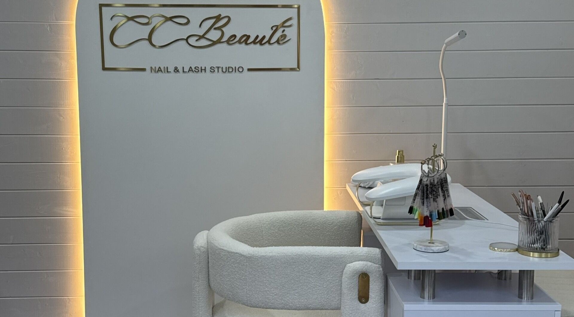 Cc Beautè nail and lash studio in Cardiff, Wales, GB with chic white decor and modern tools.