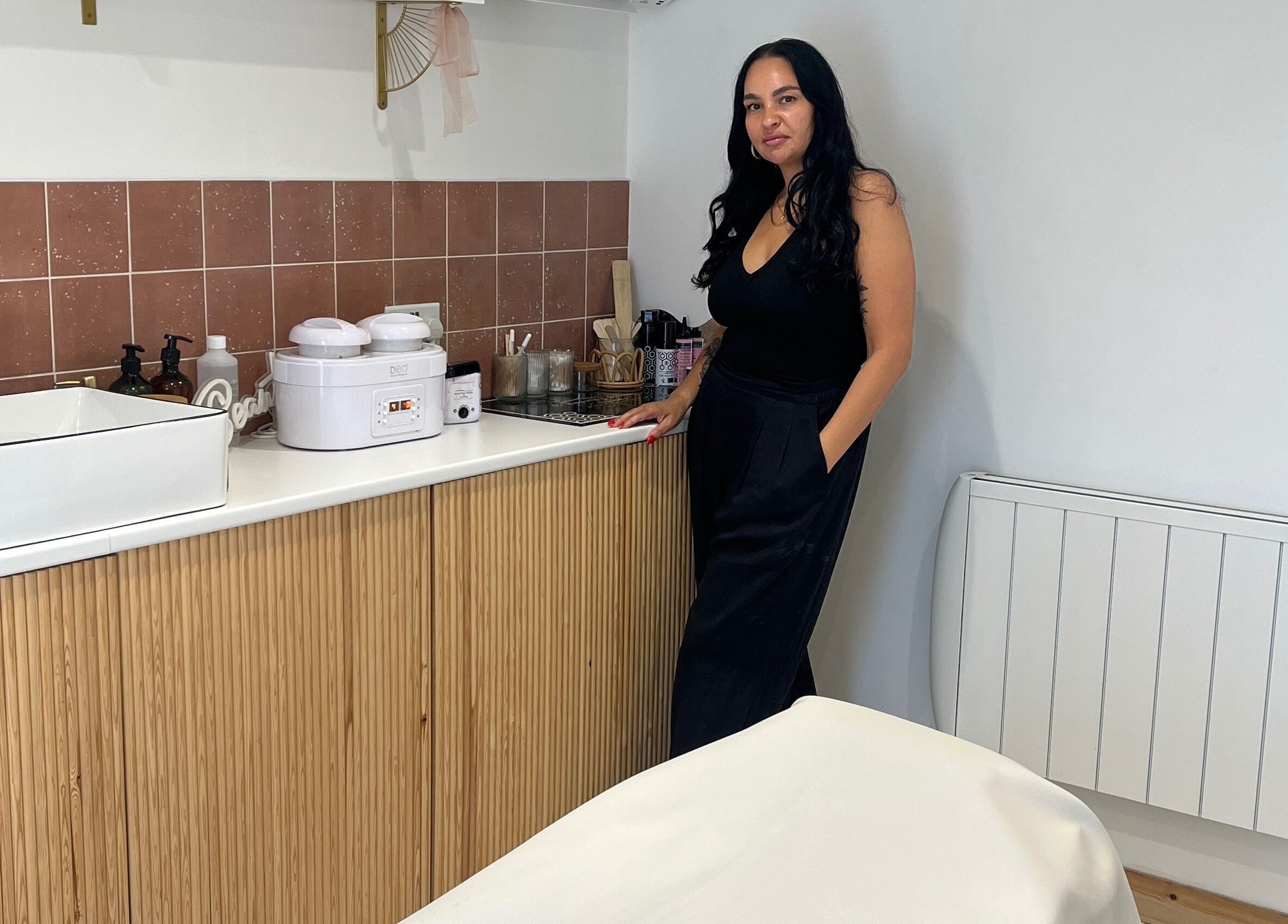 Interior of Sugared by Shola in Bristol, England, GB showcasing elegant treatment setup with staff.