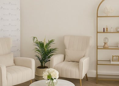 Elegant waiting area at Rhis Beauty Room on Pengam Road, Cymru, GB featuring plush chairs and minimalist decor.