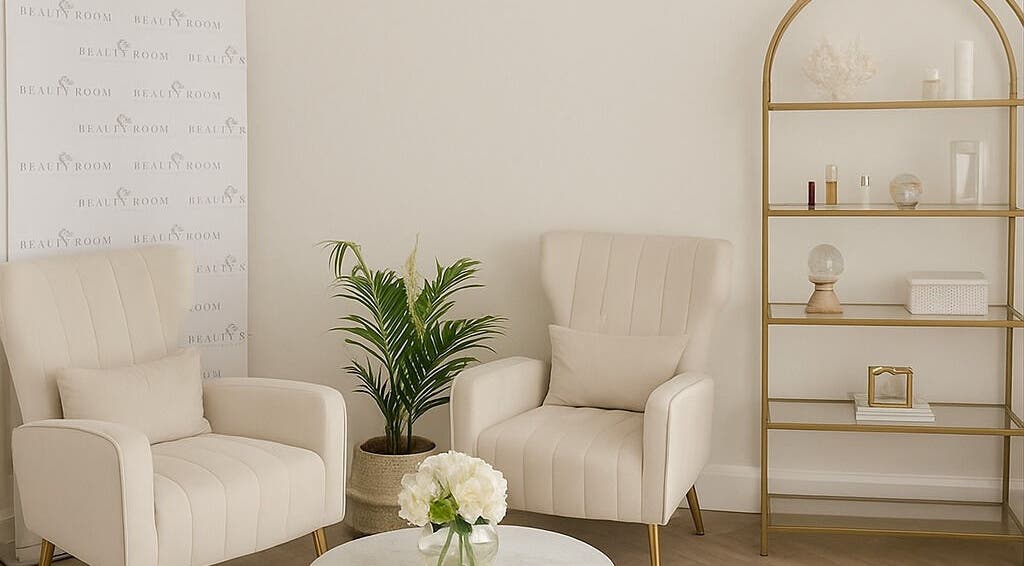 Elegant waiting area at Rhis Beauty Room on Pengam Road, Cymru, GB featuring plush chairs and minimalist decor.
