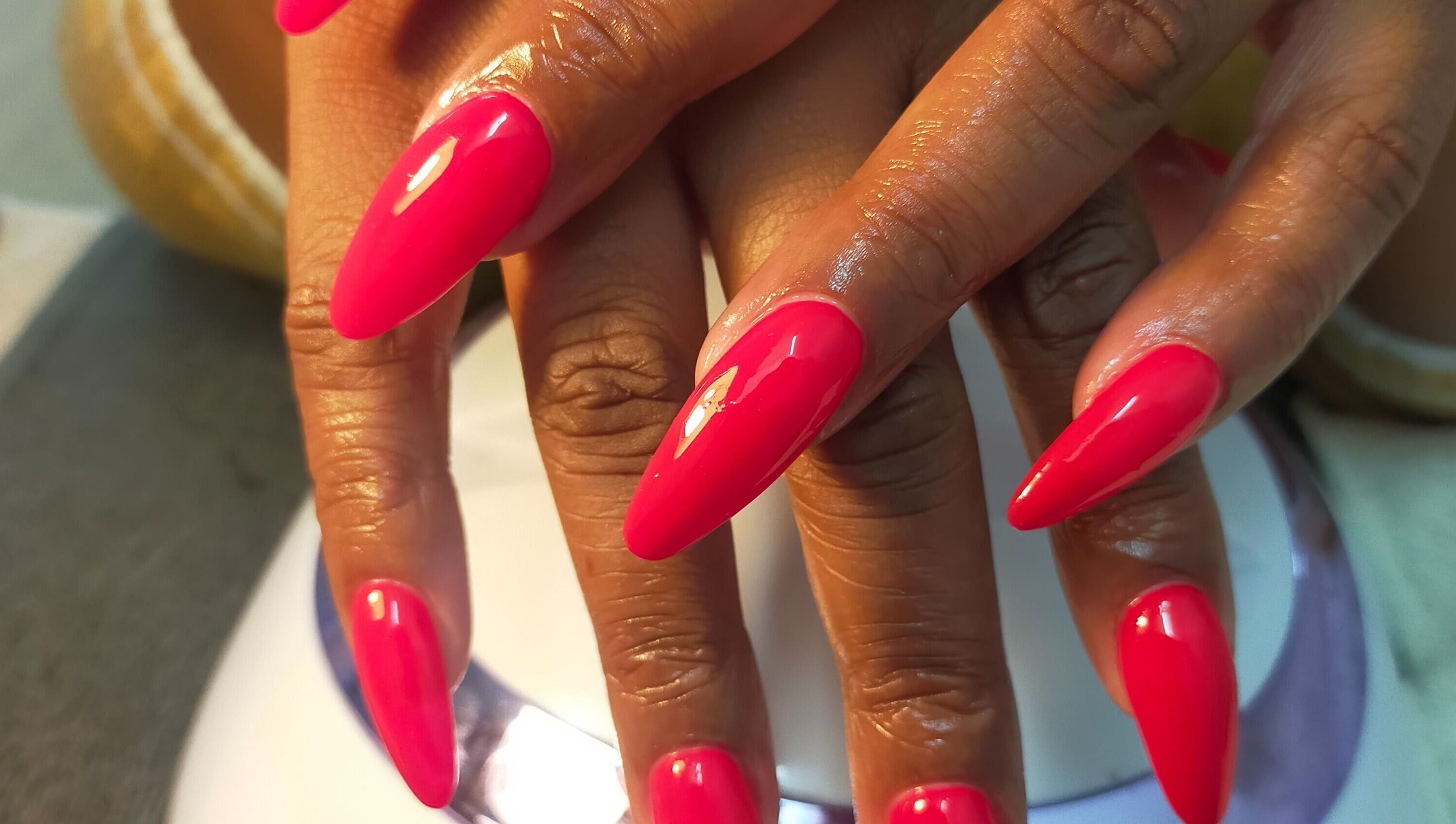 Bright pink manicure at HD Beauty Parlor in Cape Town, Western Cape, ZA showcases nail artistry.